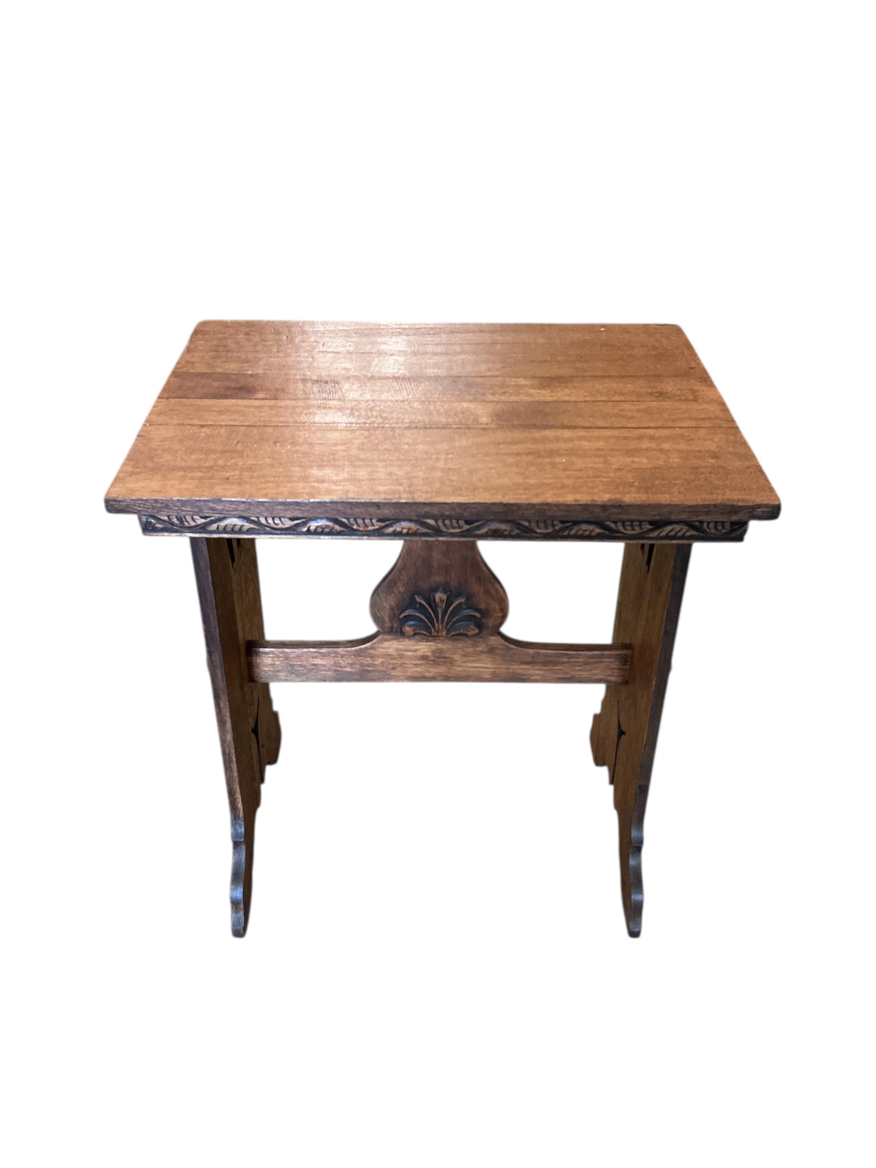 An Arts & Crafts style rectangular oak occasional table, width 63cm, depth 46cm, height 73cm
